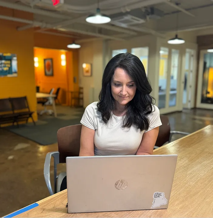crystal working on laptop
