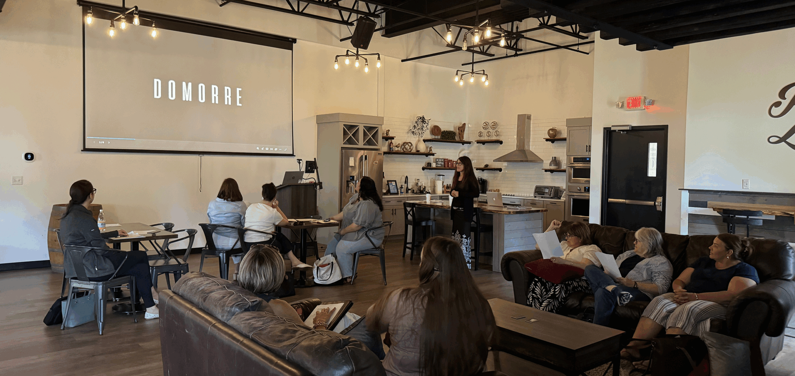 team watching DOMORRE presentation